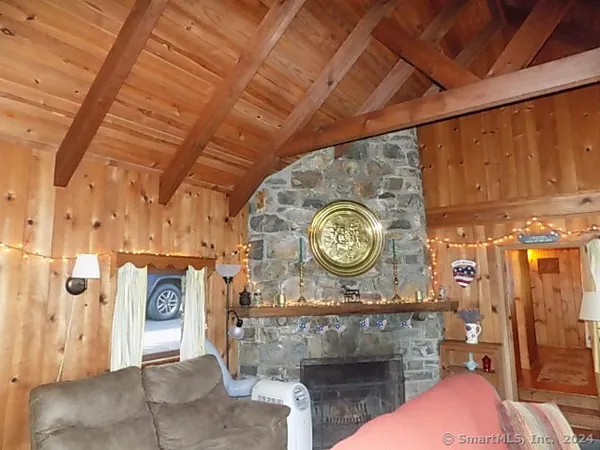 a dining room with furniture window and outside view
