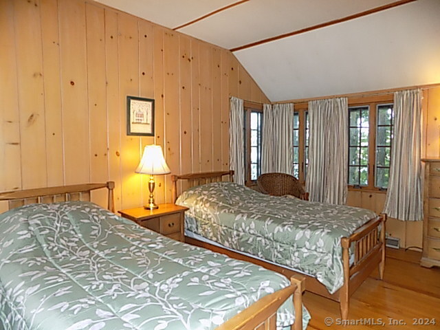 3 Partridge Lane New Fairfield, CT 06812 - Photo 18 of 26 a bedroom with a bed and dresser with wooden floor