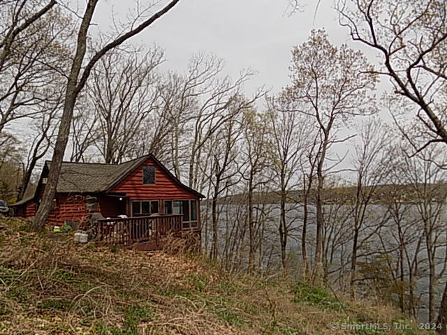 3 Partridge Lane New Fairfield, CT 06812 - Photo 22 of 26 a front view of a house with a yard