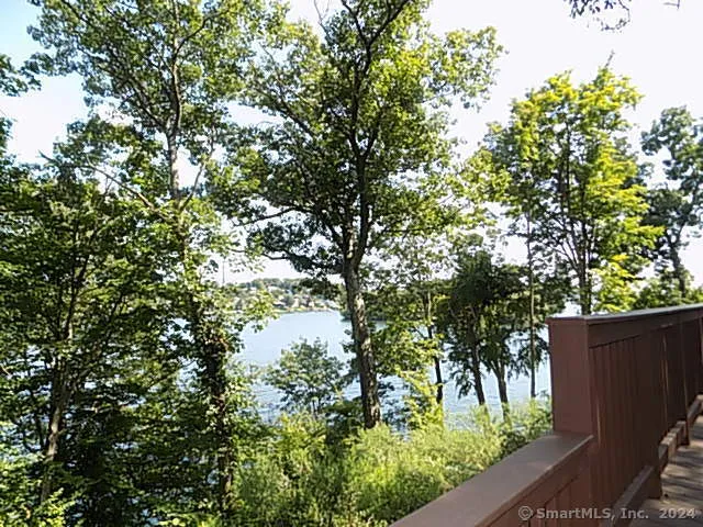 a house is sitting in middle of forest