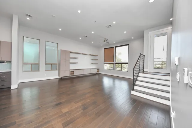 a view of an entryway with wooden floors