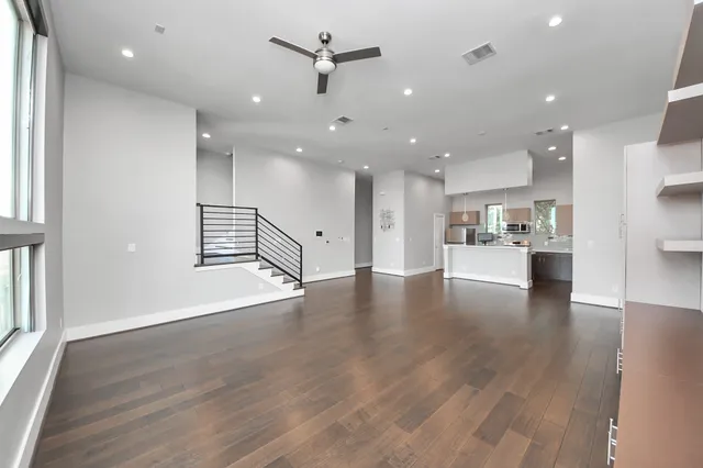 a view of kitchen with refrigerator and window