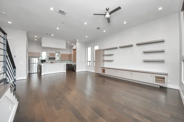 a view of a kitchen with a sink and a stove top oven