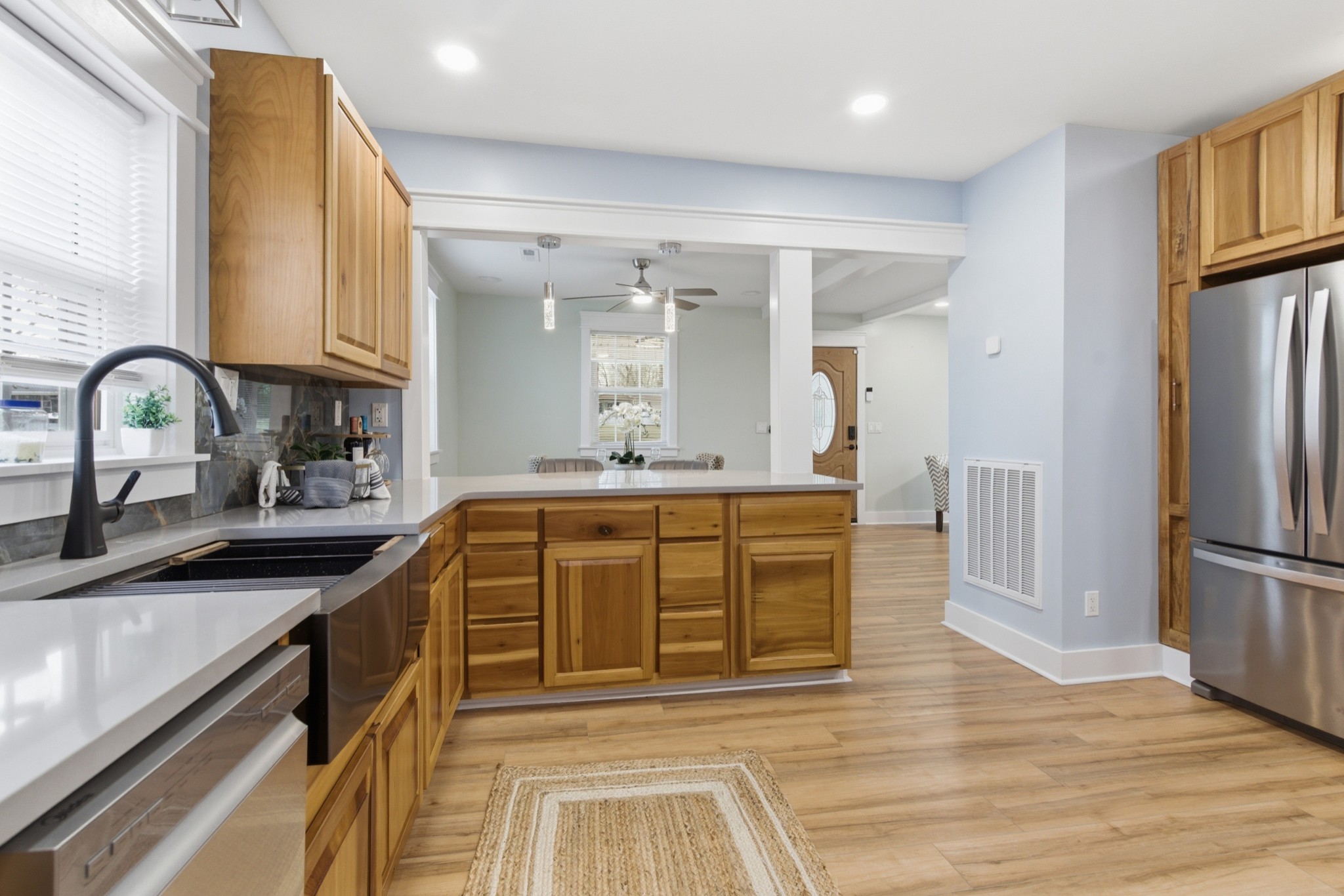 1237 Abiff Road Bon Aqua, TN 37025 - Photo 13 of 37 a kitchen with stainless steel appliances granite countertop a sink and cabinets