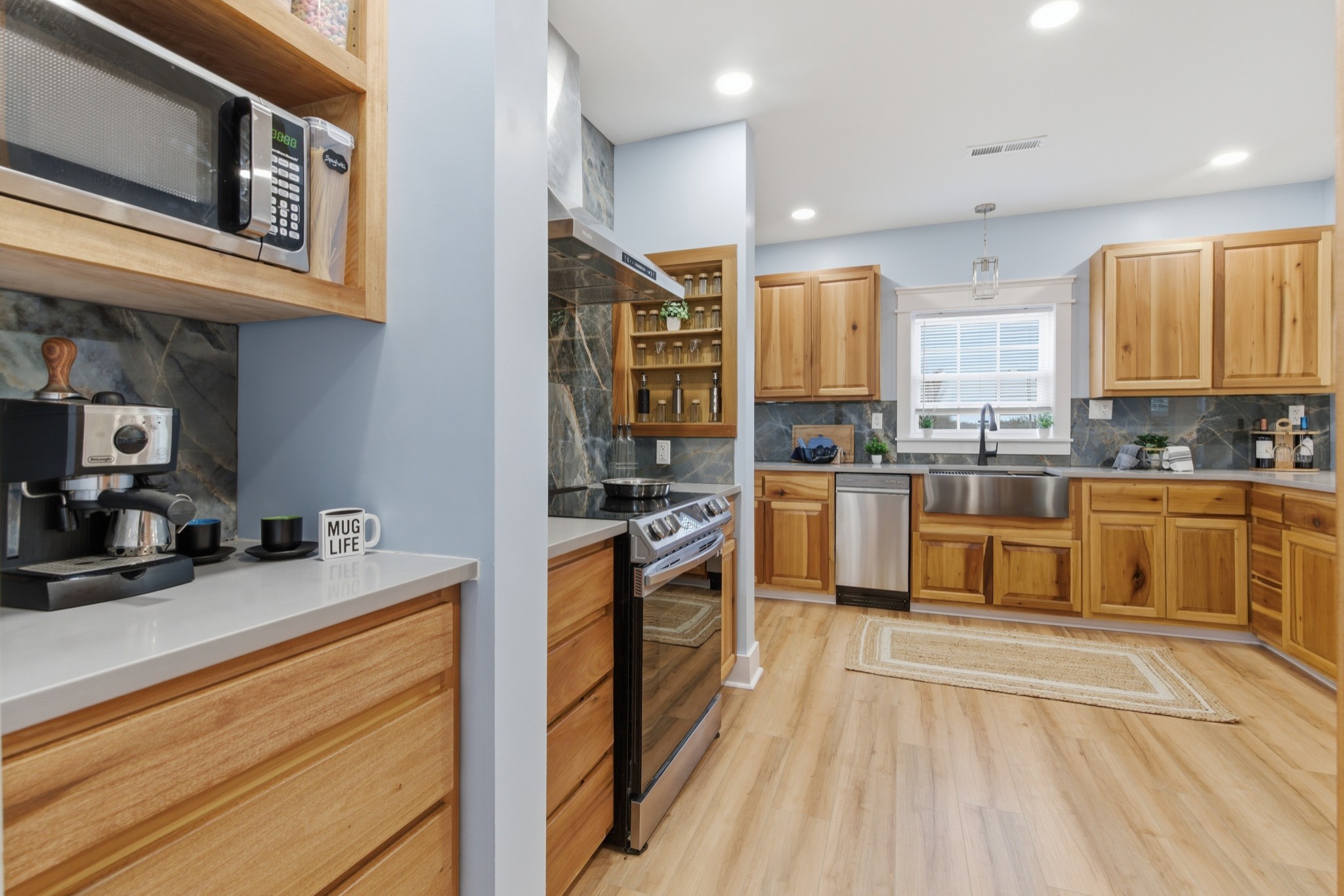 1237 Abiff Road Bon Aqua, TN 37025 - Photo 14 of 37 a kitchen with stainless steel appliances granite countertop a stove a sink and a microwave
