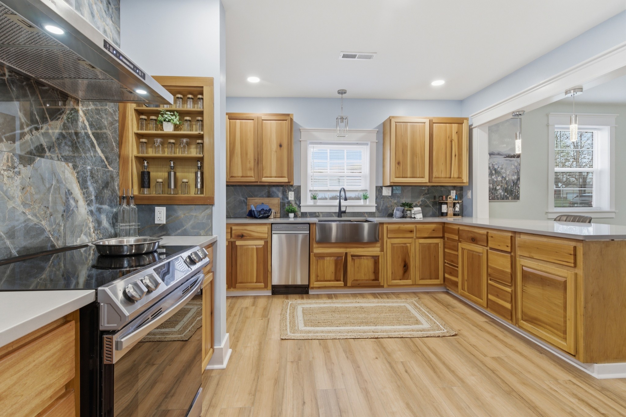 1237 Abiff Road Bon Aqua, TN 37025 - Photo 15 of 37 a kitchen with stainless steel appliances granite countertop a stove a sink and a microwave