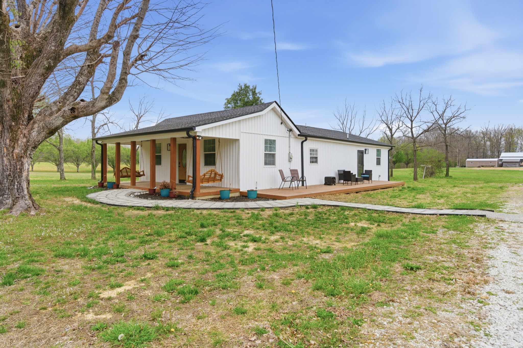 1237 Abiff Road Bon Aqua, TN 37025 - Photo 2 of 37 a view of a house with backyard and a tree