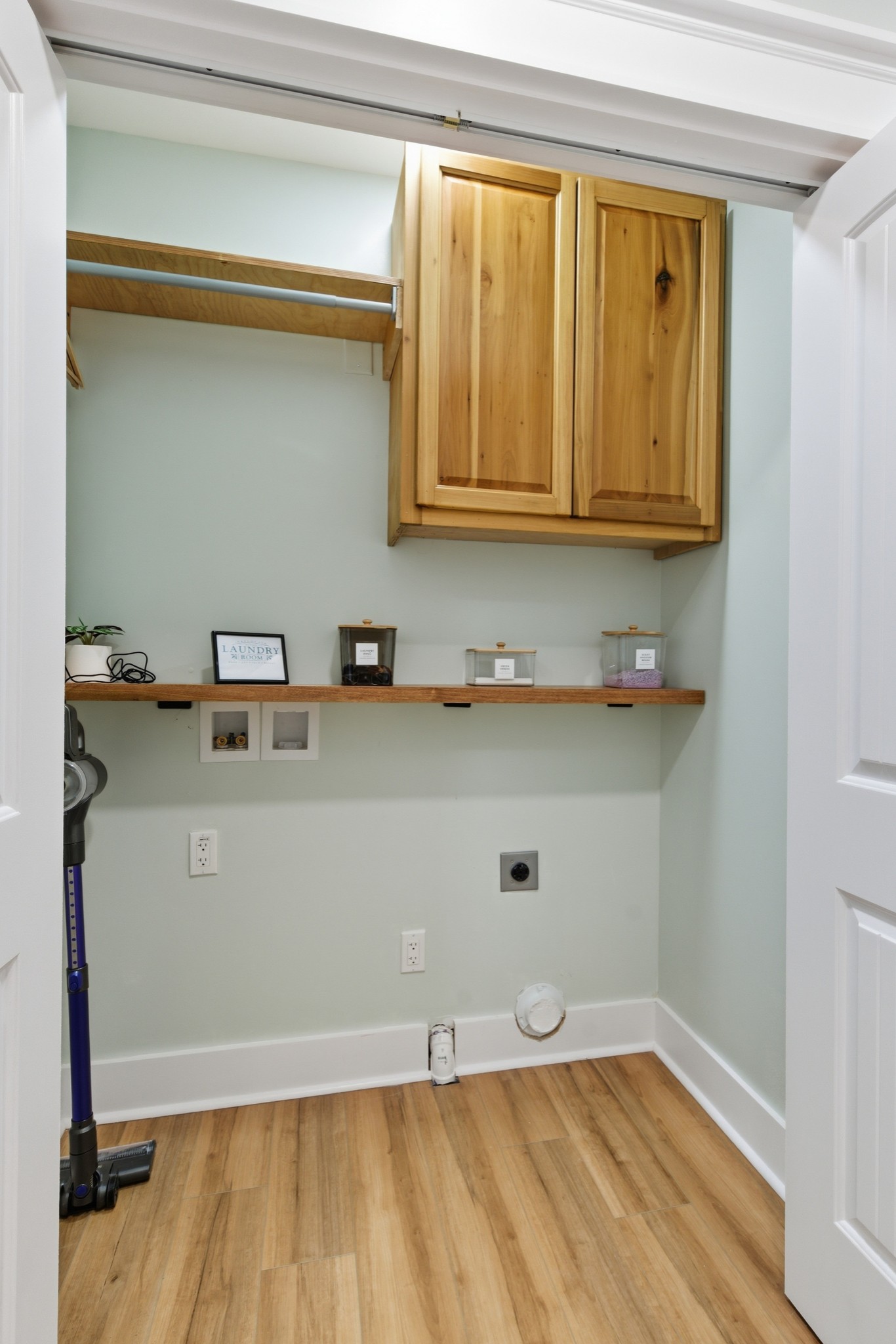 1237 Abiff Road Bon Aqua, TN 37025 - Photo 22 of 37 a room with a wooden floor and cabinets