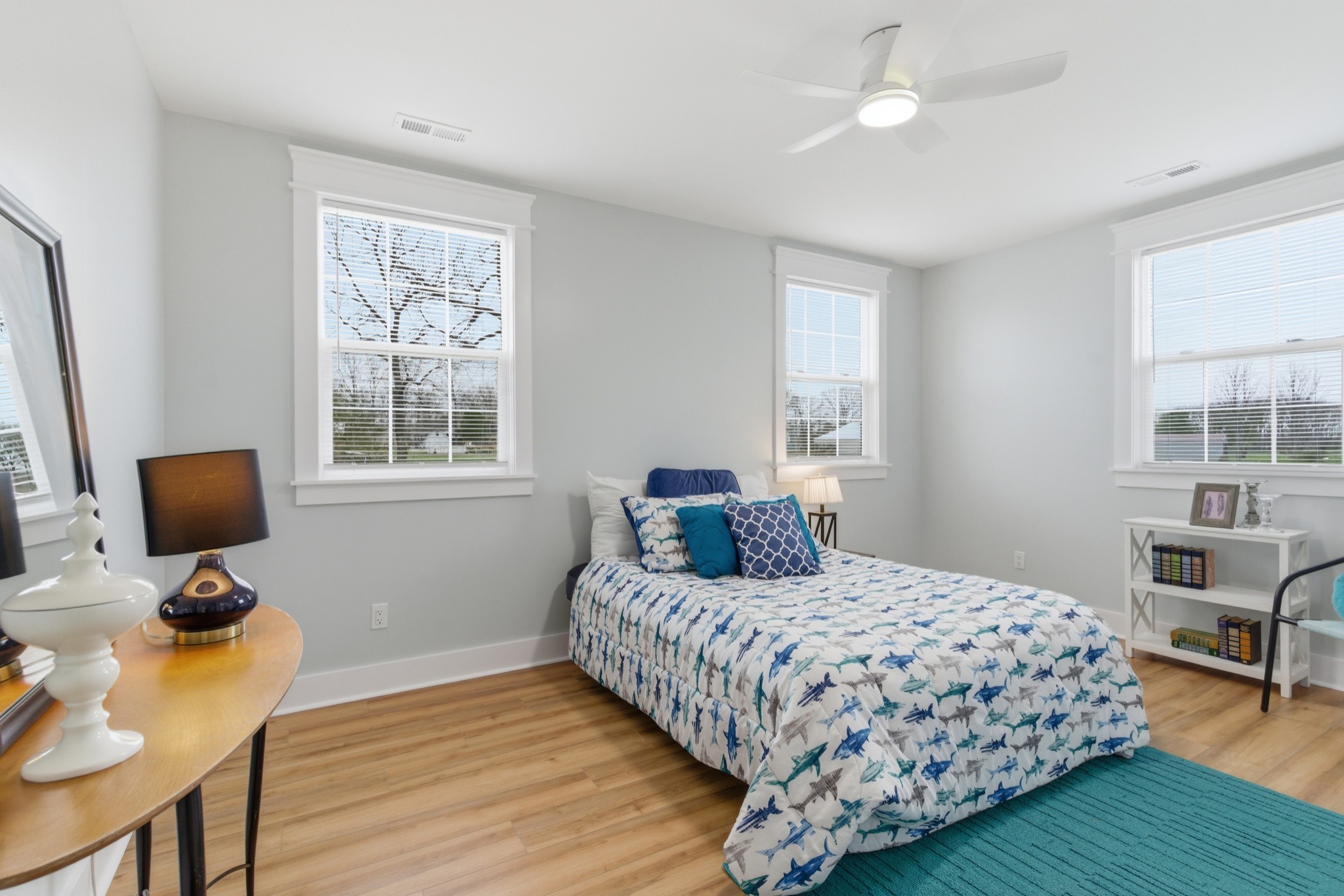 1237 Abiff Road Bon Aqua, TN 37025 - Photo 25 of 37 a bedroom with a bed a table and a window