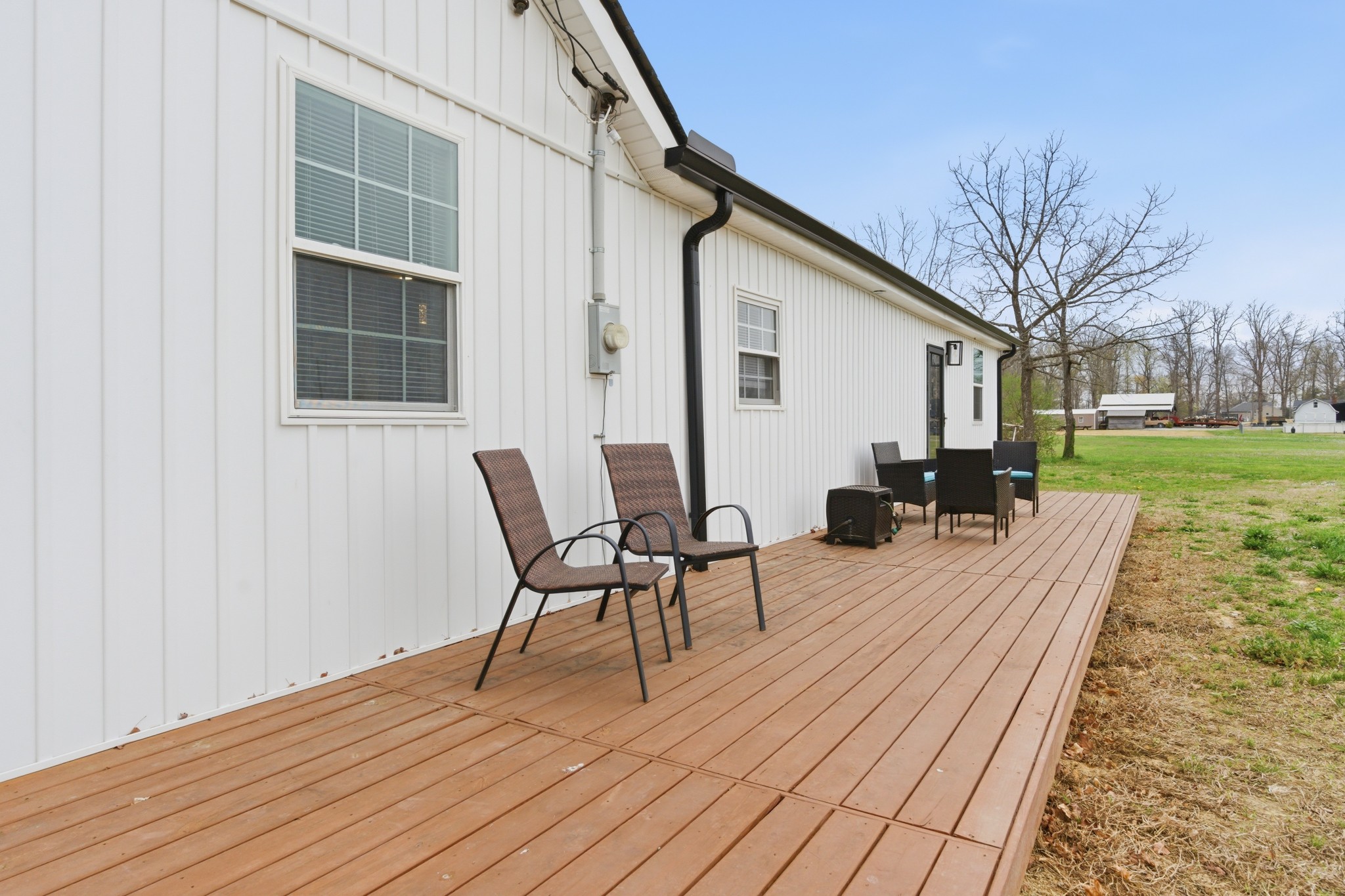 1237 Abiff Road Bon Aqua, TN 37025 - Photo 30 of 37 a view of a roof deck with table and chairs and wooden floor