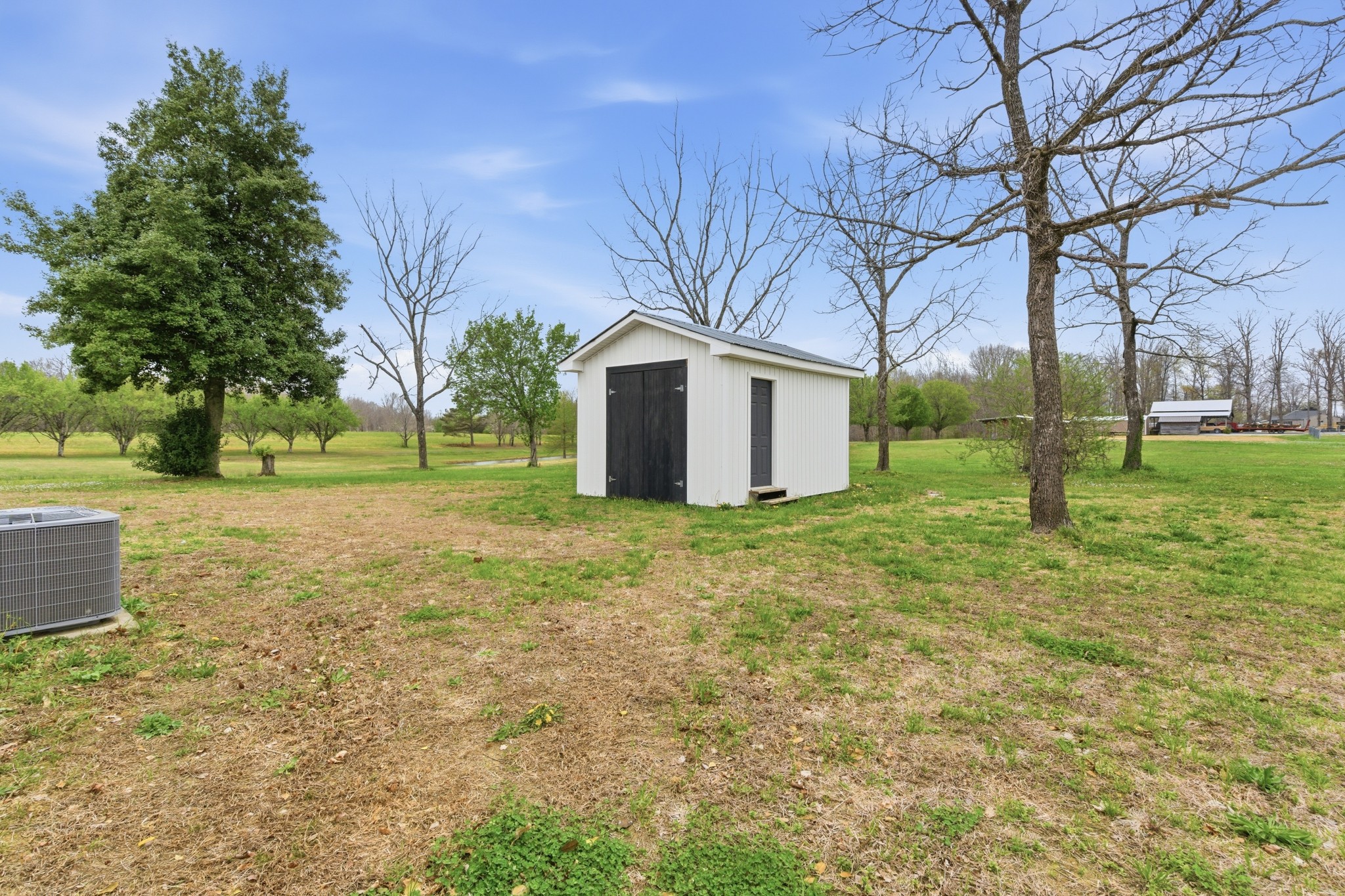 1237 Abiff Road Bon Aqua, TN 37025 - Photo 32 of 37 a view of a house with a yard