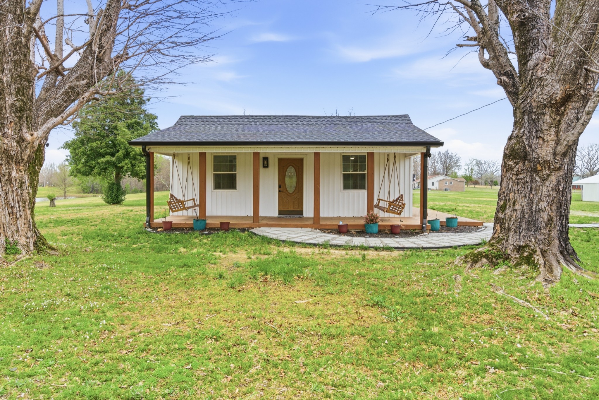 1237 Abiff Road Bon Aqua, TN 37025 - Photo 6 of 37 a view of a house with backyard and a tree