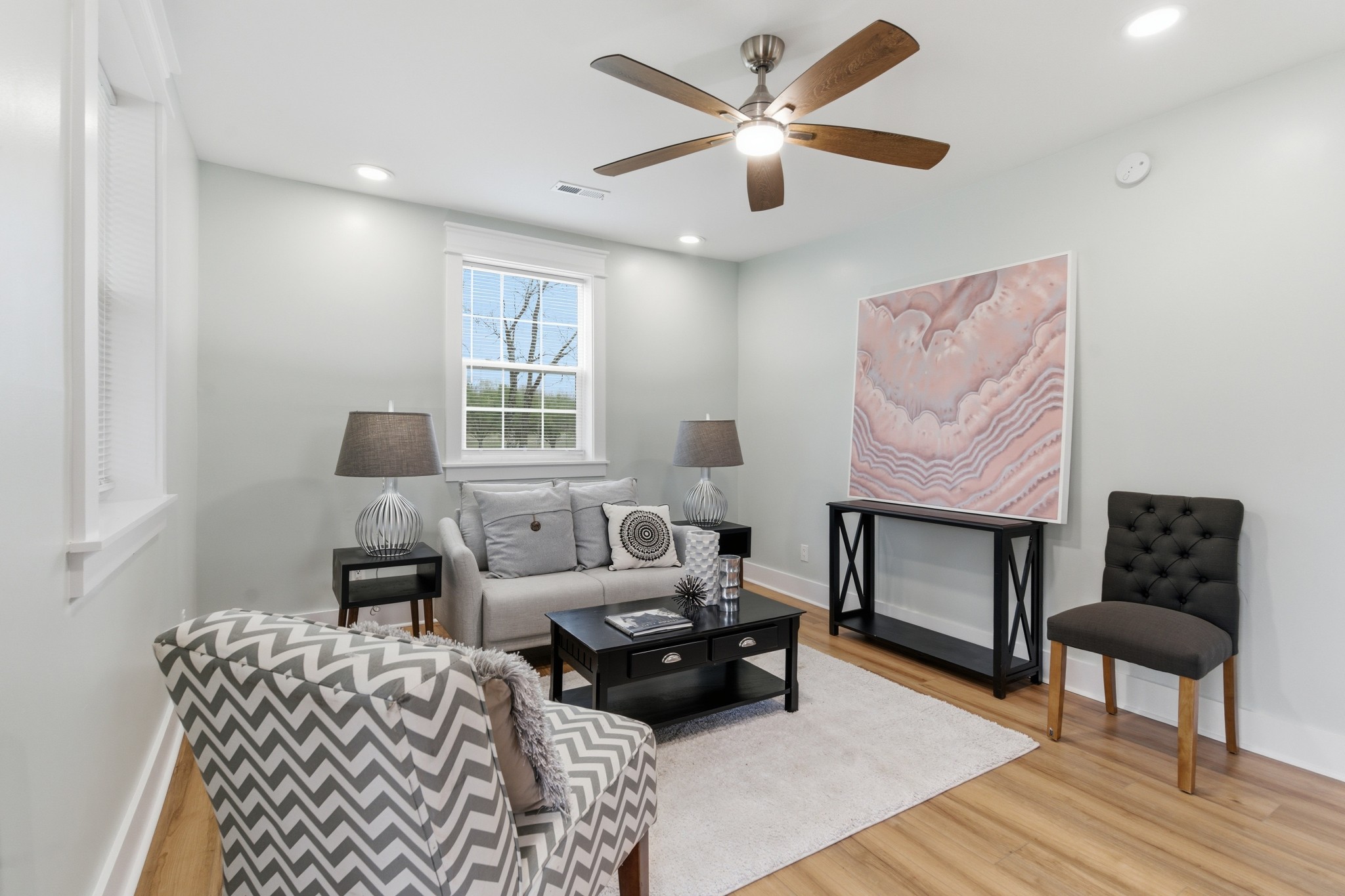 1237 Abiff Road Bon Aqua, TN 37025 - Photo 8 of 37 a living room with furniture a fireplace and a flat screen tv