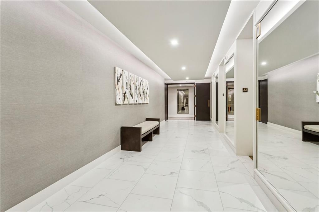 2660 Peachtree Road Northwest, Unit 32C Atlanta, GA 30305 - Photo 18 of 55 a view of a hallway with cabinet and a rug