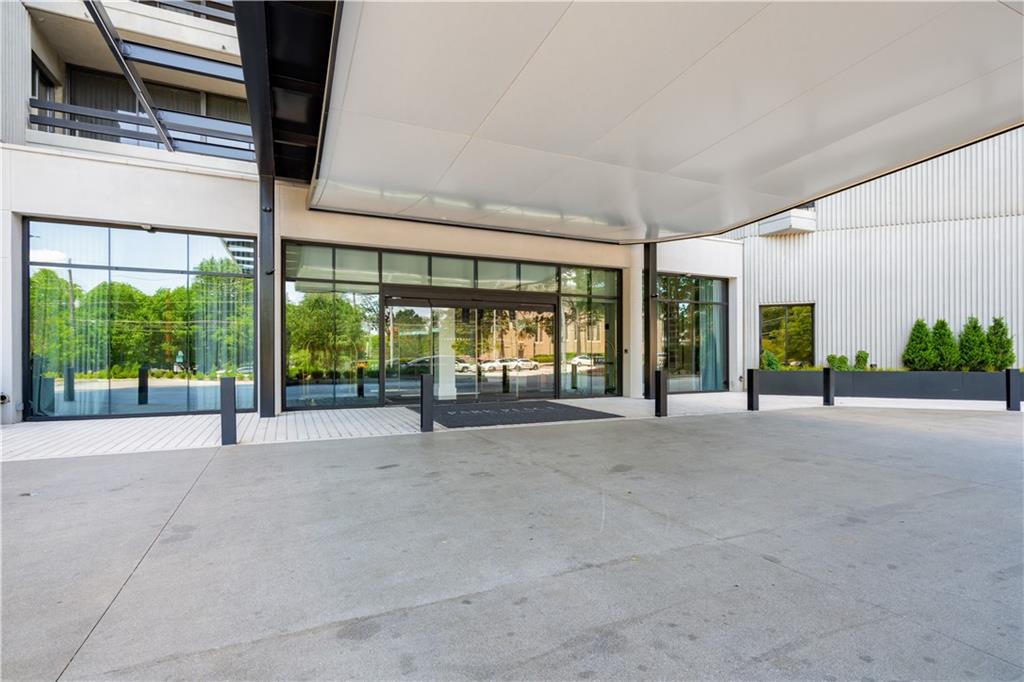 2660 Peachtree Road Northwest, Unit 32C Atlanta, GA 30305 - Photo 25 of 55 a view of an empty room with a balcony