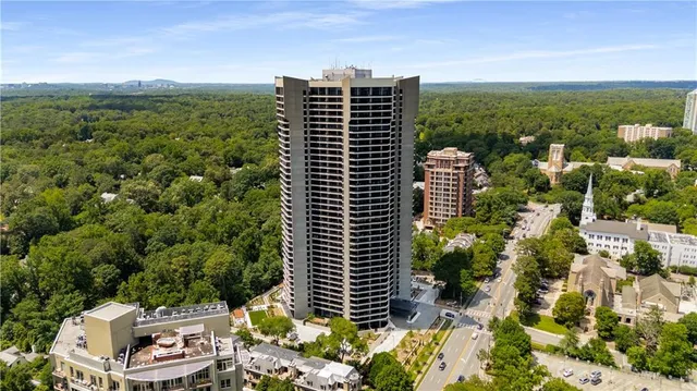 an aerial view of residential houses with city view