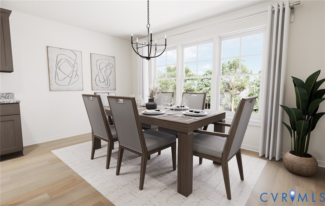 282 Greenpark Road Sandston, VA 23150 - Photo 11 of 29 a view of a dining room with furniture window and wooden floor