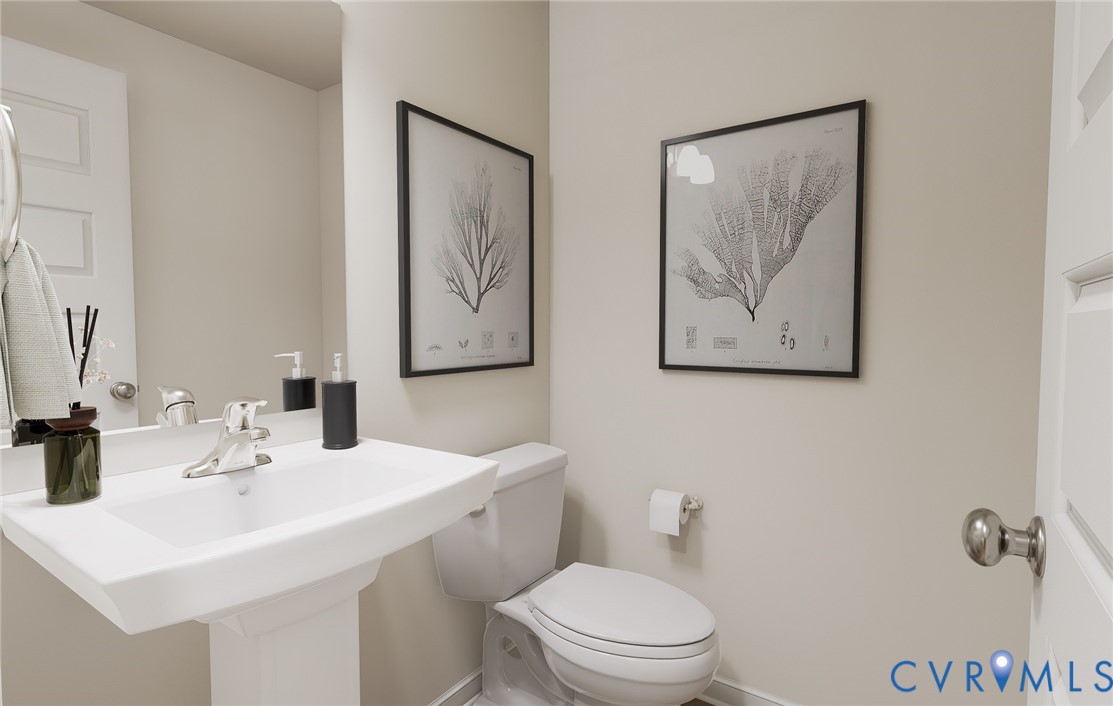282 Greenpark Road Sandston, VA 23150 - Photo 12 of 29 a bathroom with a toilet a sink and mirror