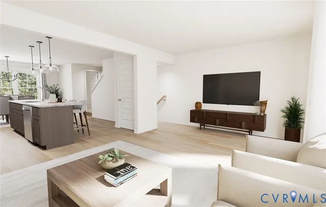 a living room with furniture and a flat screen tv