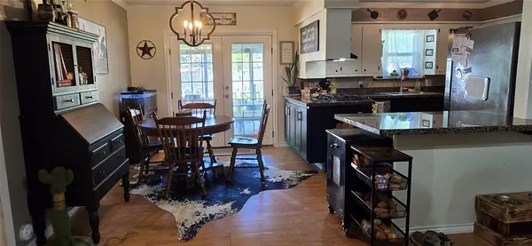 a dining room with furniture and window