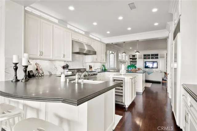 a living room with lots of furniture and a large window