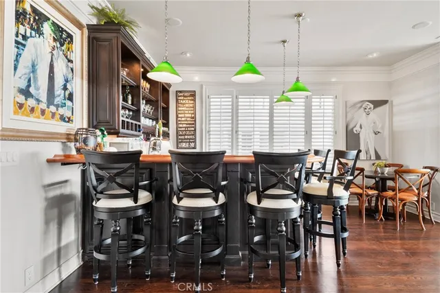 a kitchen with stainless steel appliances granite countertop a refrigerator and a stove