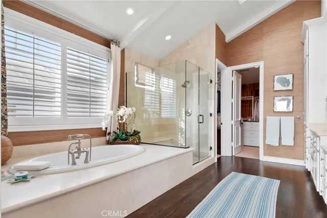 a view of a house with swimming pool and sitting area