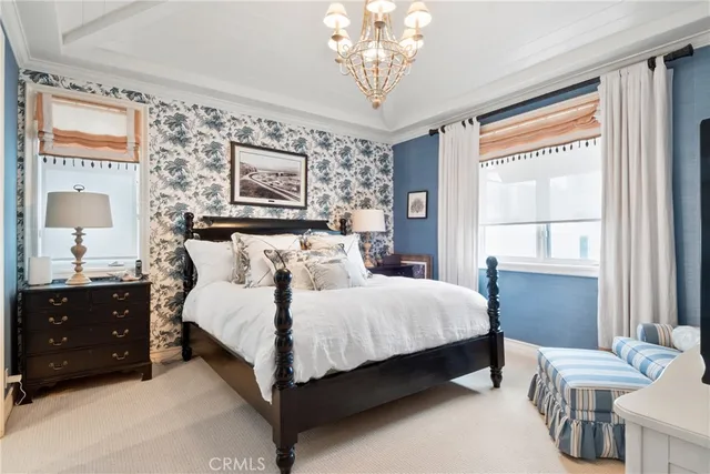 a view of a patio with couches table and chairs with wooden floor and fence