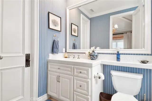 a view of a balcony with a floor to ceiling window next to a building