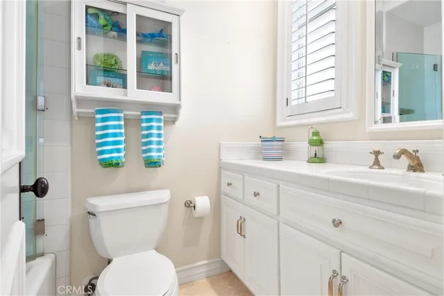 a kitchen with stainless steel appliances a sink stove and cabinets