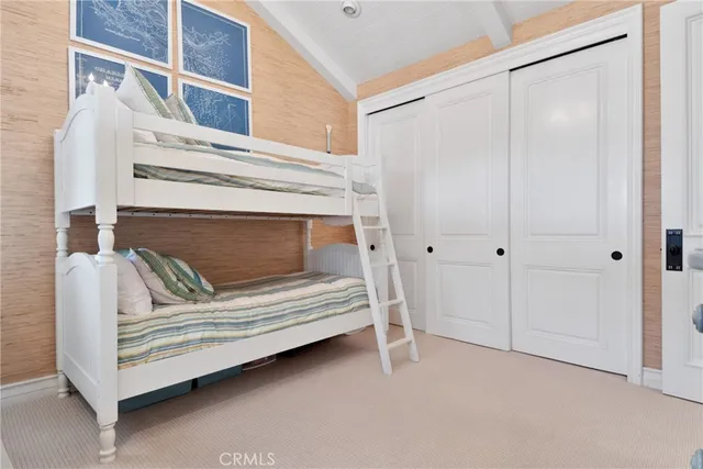 a spacious bathroom with double sink and a large mirror