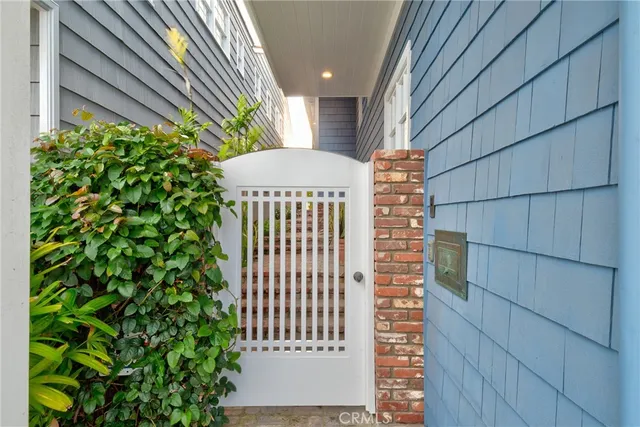 a living room with furniture a flat screen tv and a bookshelf
