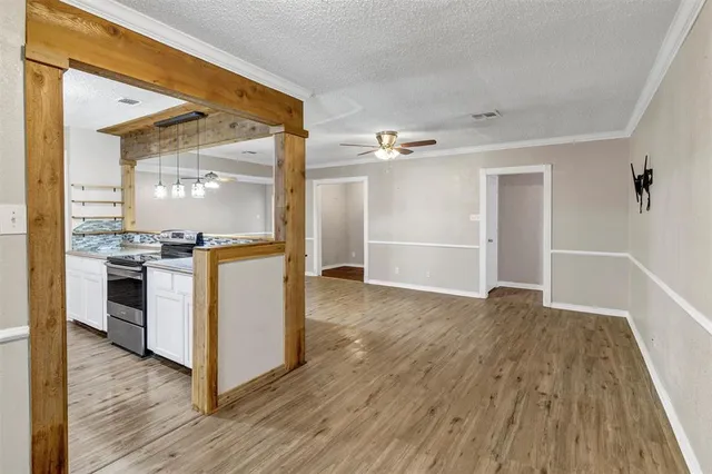 a view of kitchen with sink and wooden floor