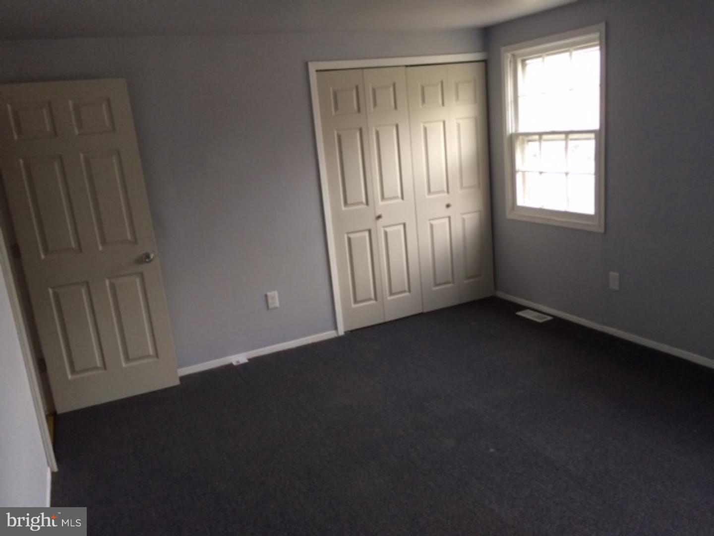 22 Roxborough Place Willingboro, NJ 08046 - Photo 7 of 14 an empty room with windows