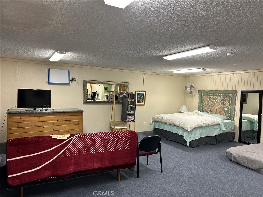 7025 Cuddy Valley Road, Unit F & H Frazier Park, CA 93225 - Photo 3 of 19 a bedroom with a bed and flat screen tv