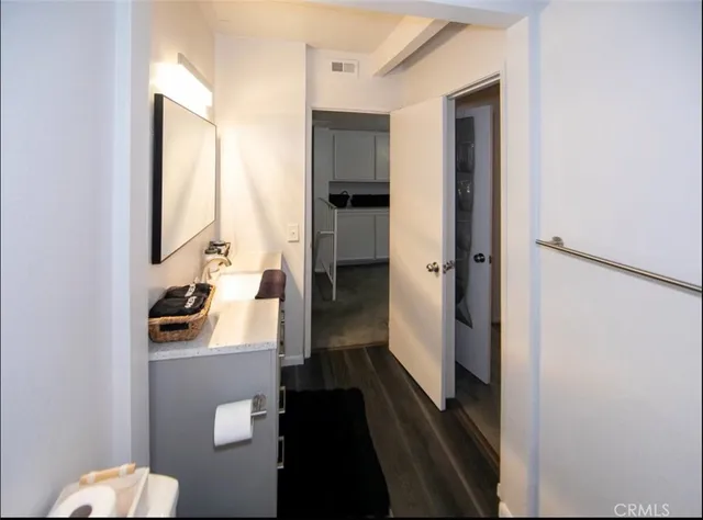 a bedroom with a bed and lamp