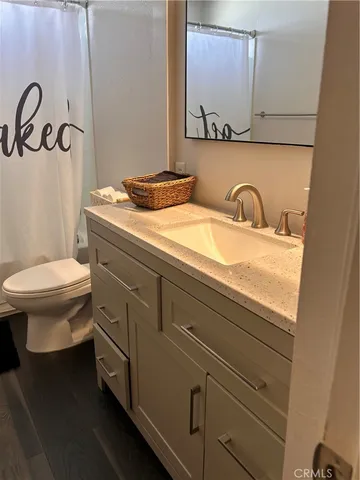 a bedroom with two beds and a dresser