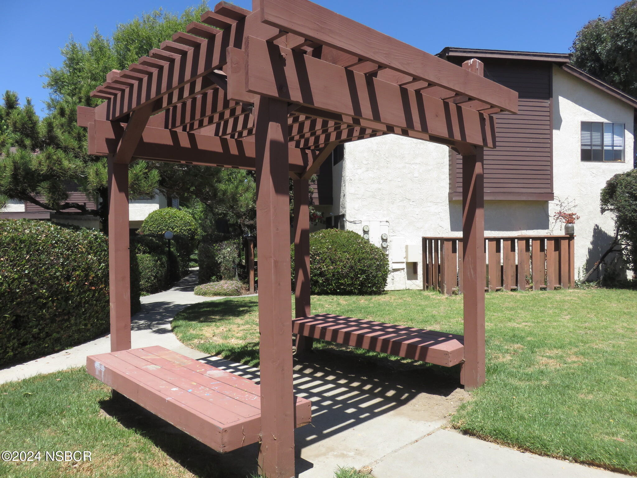 1218 East Walnut Avenue, Unit B Lompoc, CA 93436 - Photo 2 of 11 a view of a chair and table in backyard of the house