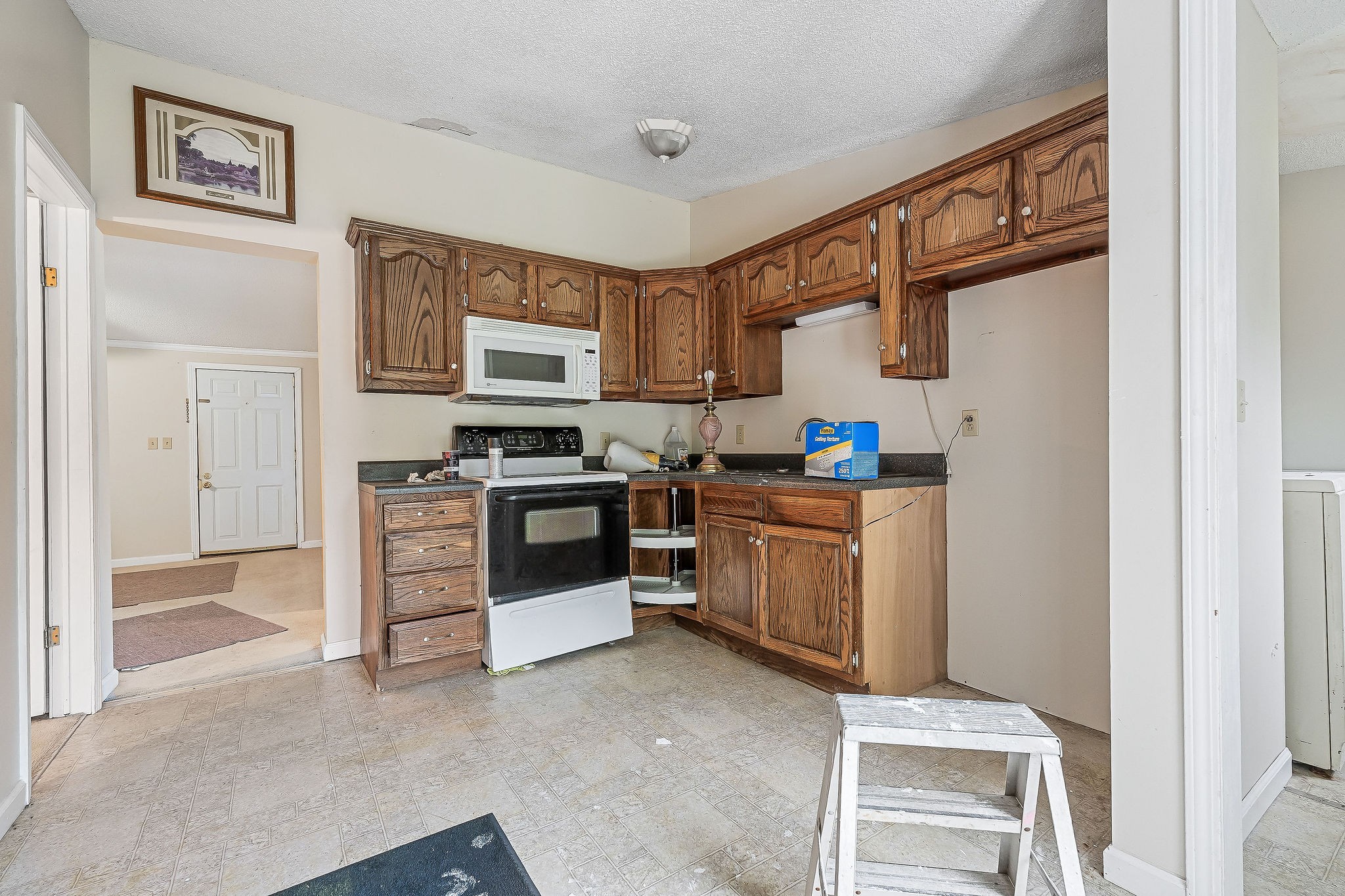 229 Craig Road Monterey, TN 38574 - Photo 3 of 18 a kitchen with stainless steel appliances a stove top oven a sink a counter top space and cabinets