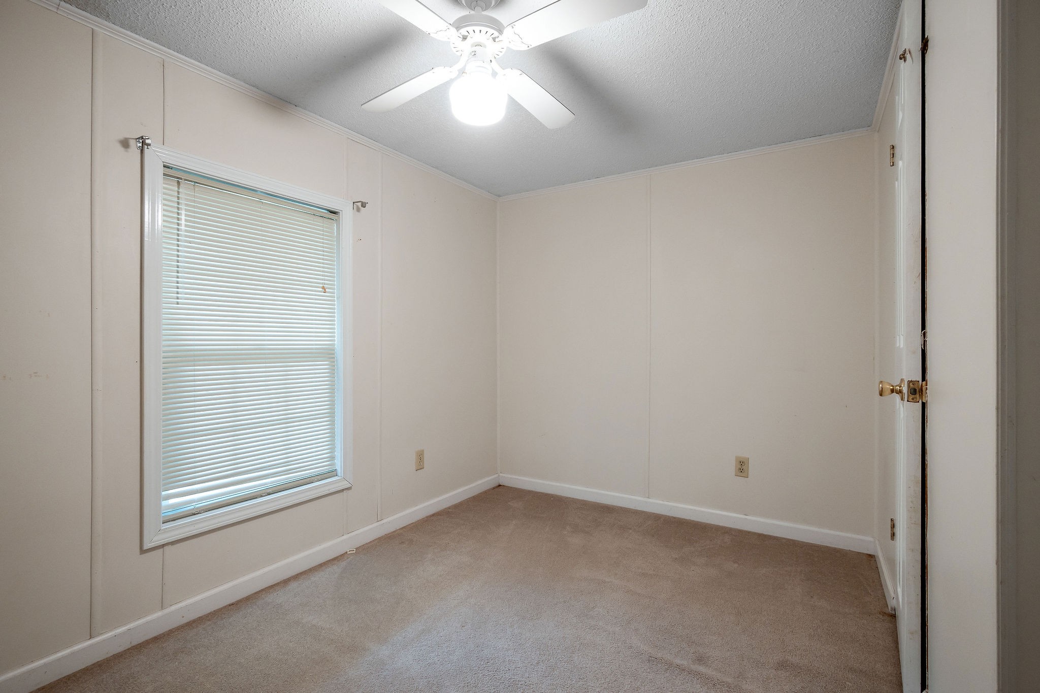229 Craig Road Monterey, TN 38574 - Photo 9 of 18 an empty room with a chandelier fan
