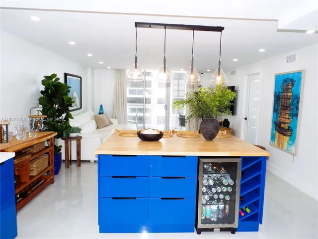 a bedroom with a bed and a potted plant
