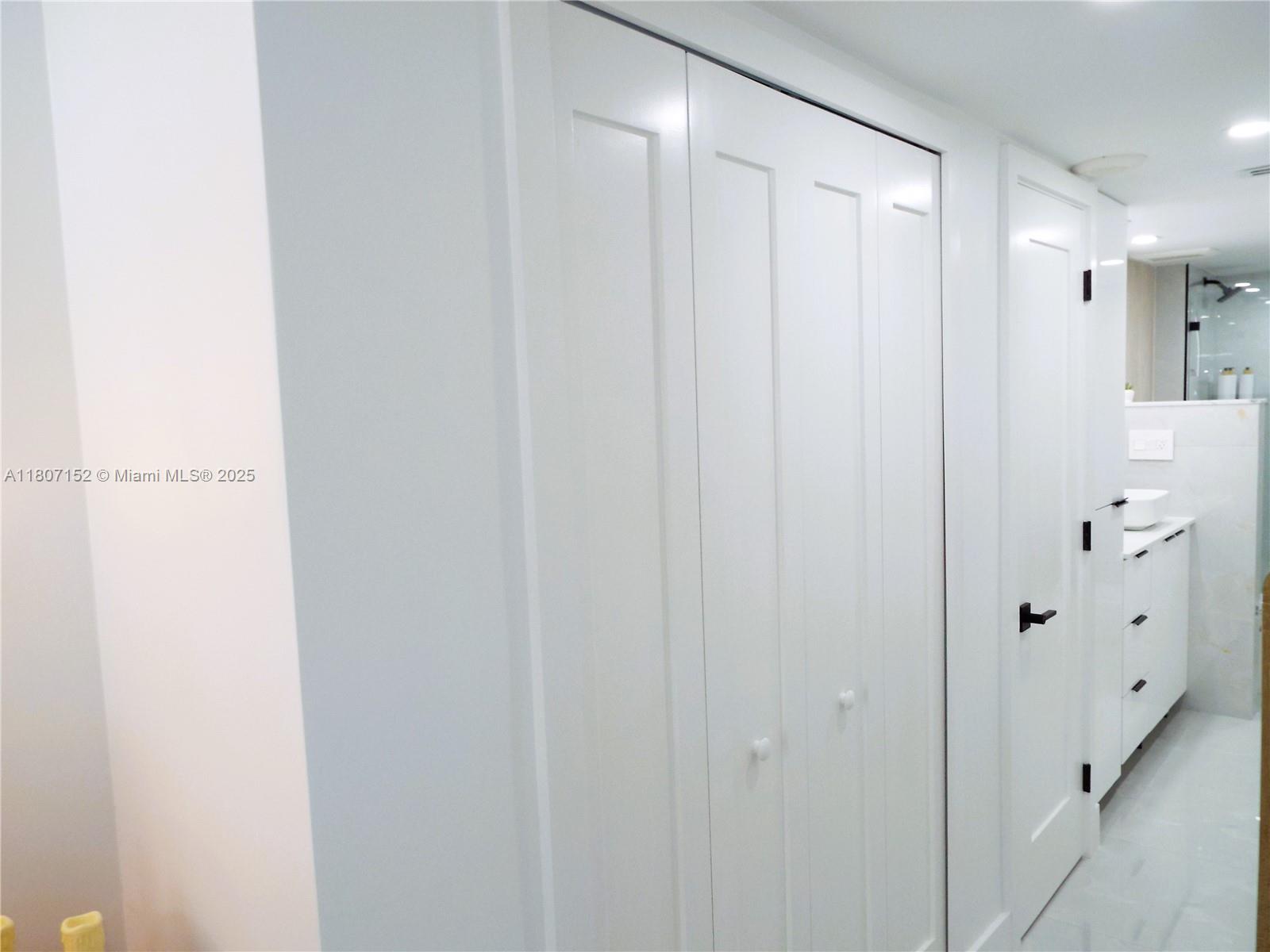 5701 Collins Avenue, Unit 1619 Miami Beach, FL 33140 - Photo 26 of 77 a view of an entryway with white walls