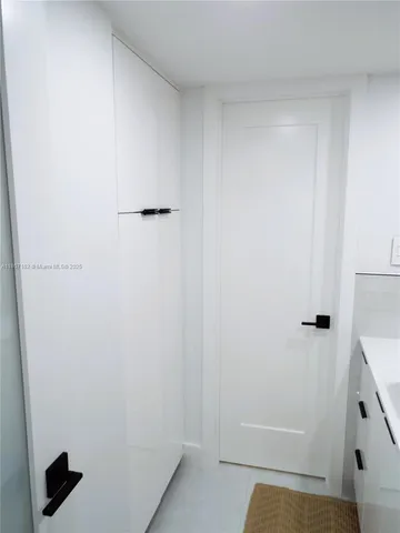 a large bed sitting in a bedroom next to a small yard