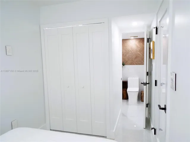 a lobby with furniture and potted plant