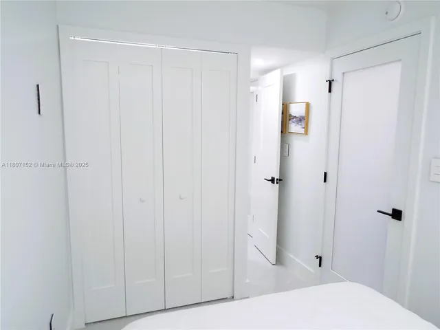 a view of a glass door and an empty room with glass door