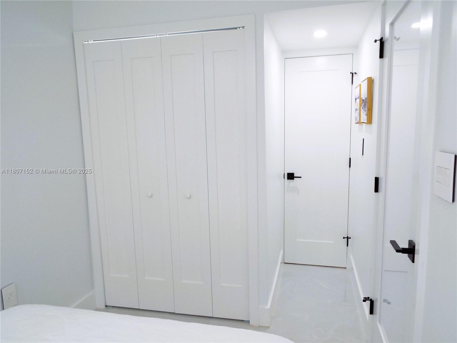 5701 Collins Avenue, Unit 1619 Miami Beach, FL 33140 - Photo 41 of 77 a bathroom with a shower and a glass door