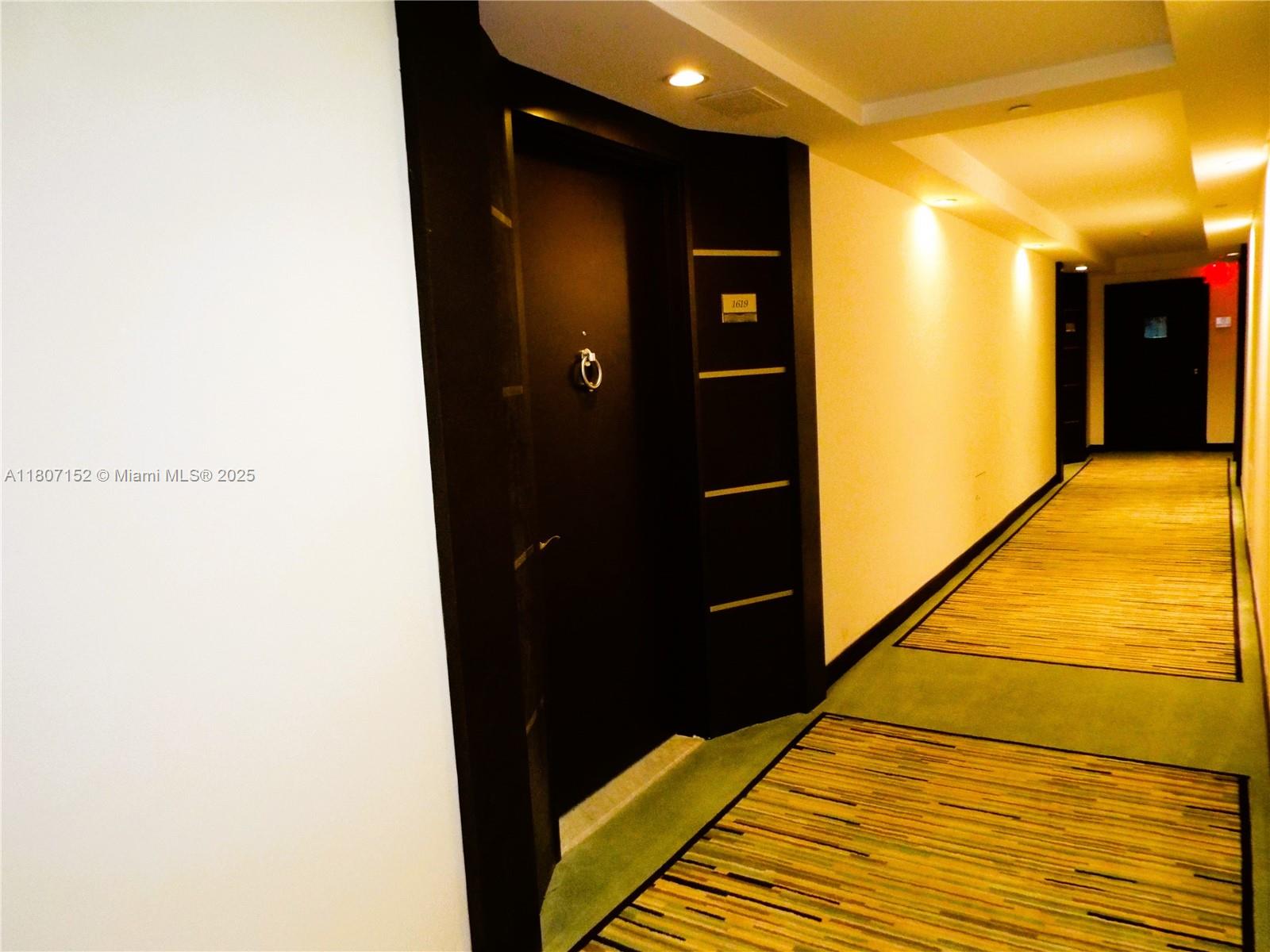 5701 Collins Avenue, Unit 1619 Miami Beach, FL 33140 - Photo 49 of 77 a view of a hallway