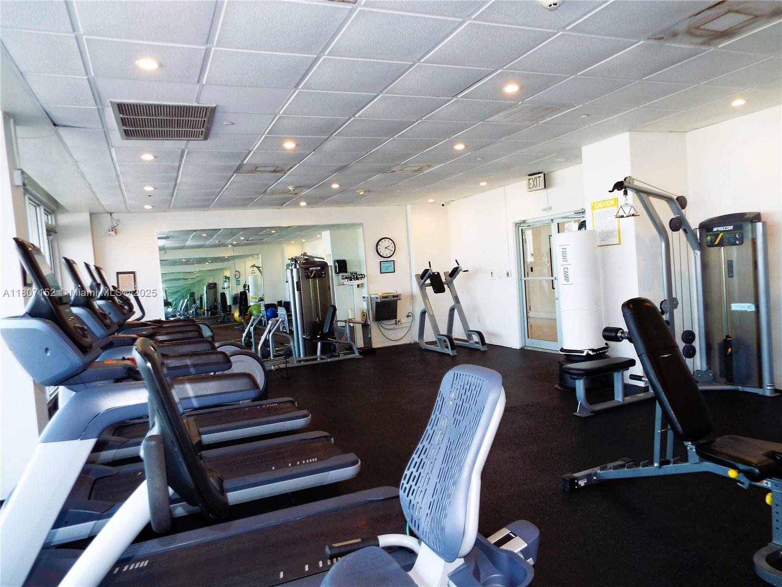5701 Collins Avenue, Unit 1619 Miami Beach, FL 33140 - Photo 60 of 77 a view of a room with gym equipment