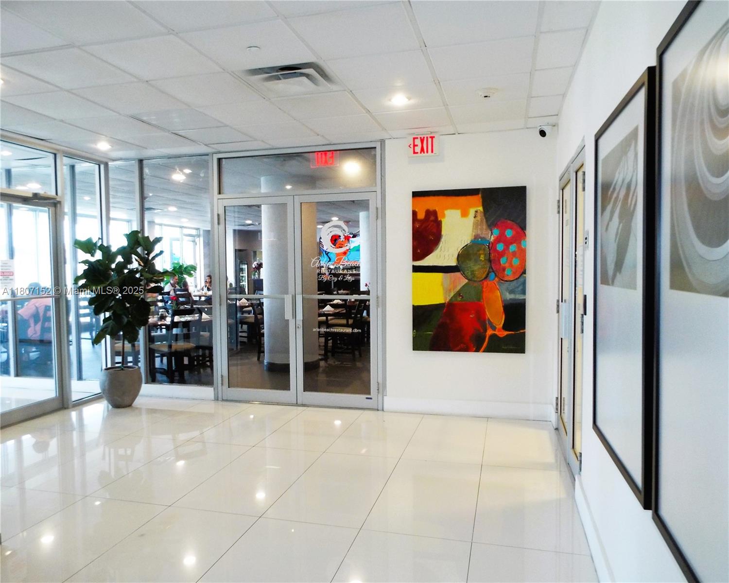 5701 Collins Avenue, Unit 1619 Miami Beach, FL 33140 - Photo 61 of 77 a view of a hallway with a elevator