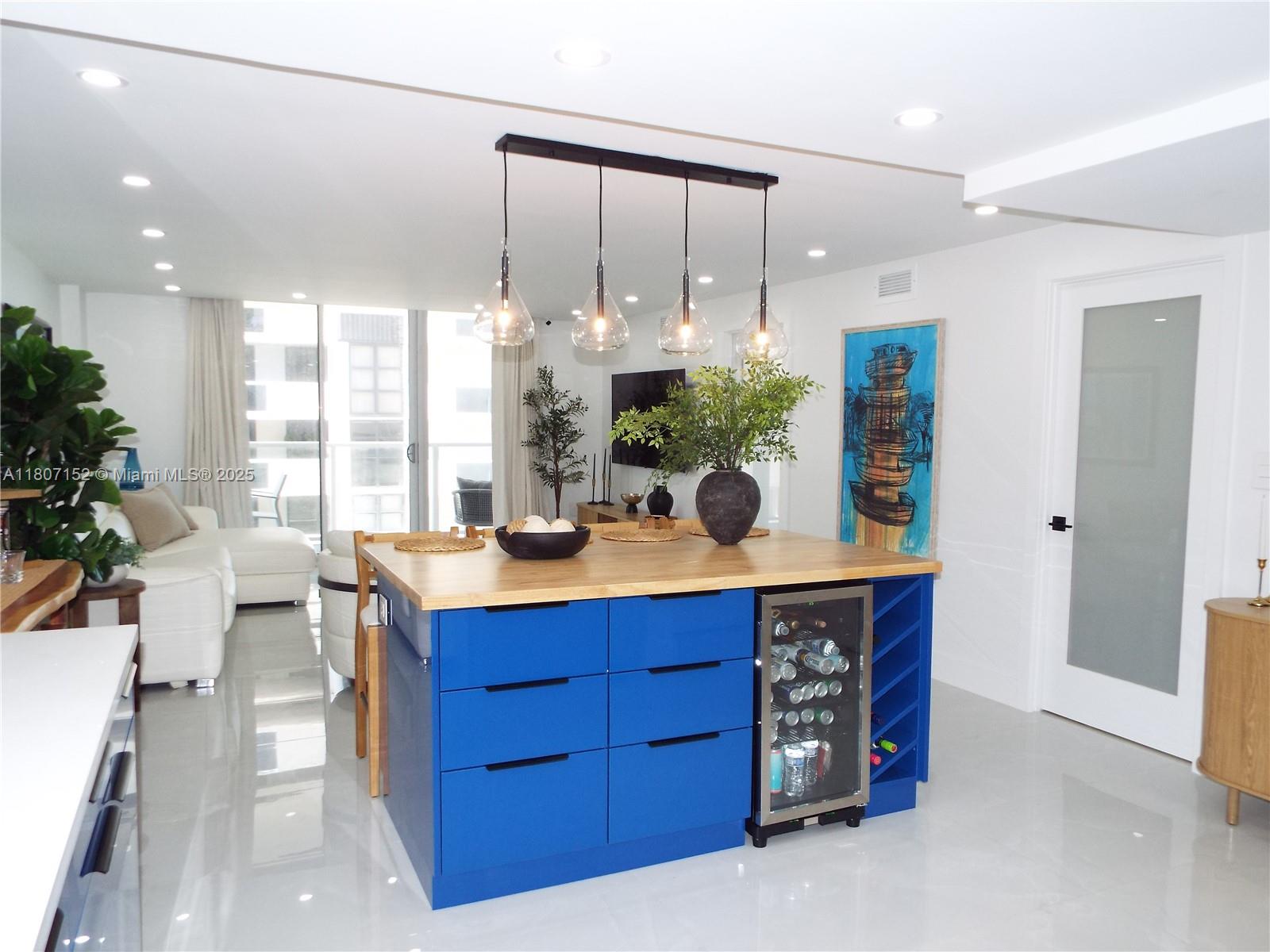 5701 Collins Avenue, Unit 1619 Miami Beach, FL 33140 - Photo 8 of 77 a kitchen with granite countertop a sink and a cabinets